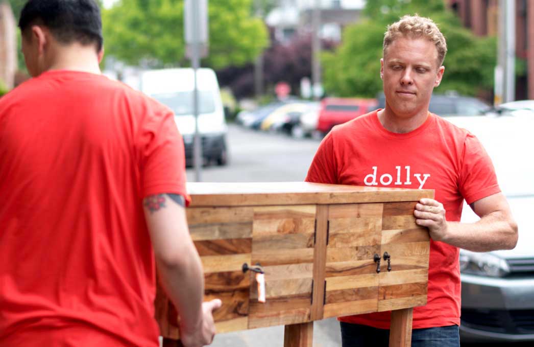 2 Dolly Helpers lifting a credenza